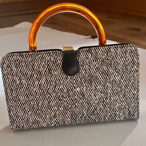 Elegant Black and White Clutch with Amber Handle Removable